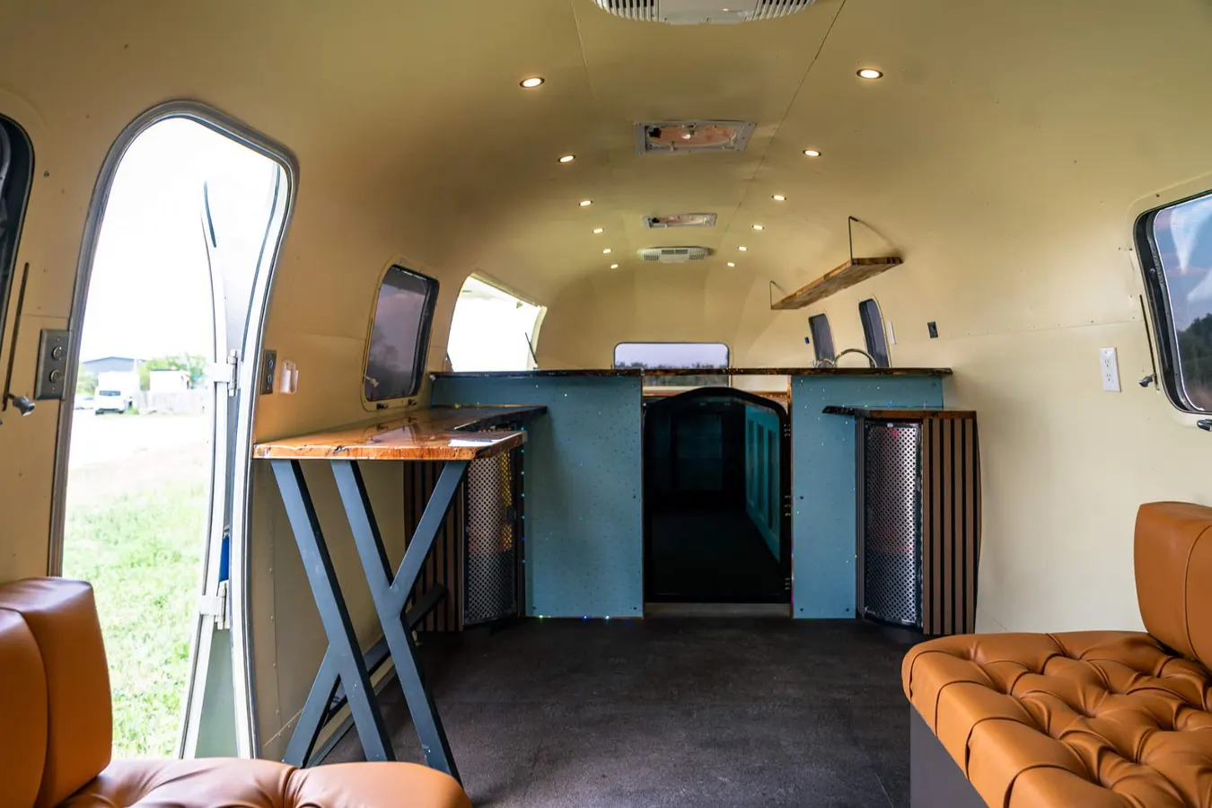 Interior lounge with leather seating and live-edge bar