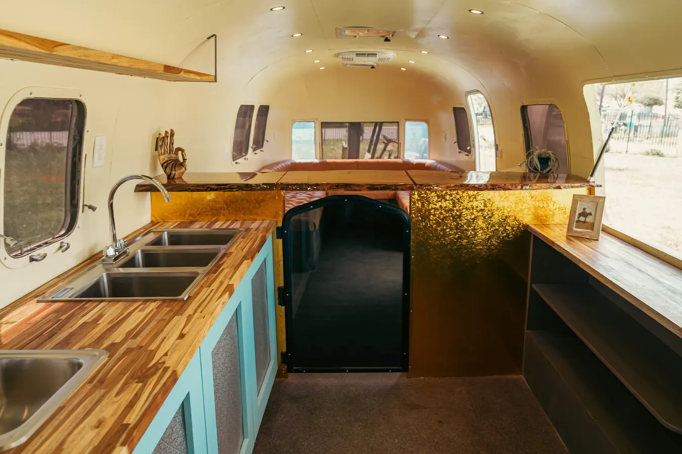 Full service bar interior with sinks and gold accents